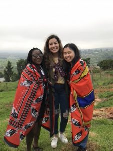 Three people smiling