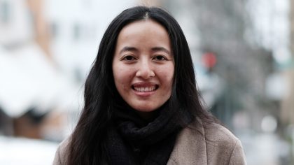 Woman with long hair standing outside