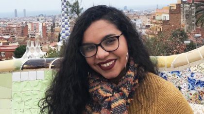 Woman with glasses and long hair outside