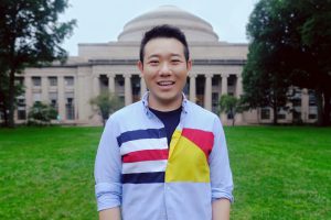 Man smiling in front of the MIT dome