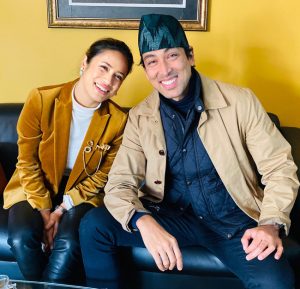 Dig Bijay Mahat and Rupa Shah smiling on a sofa